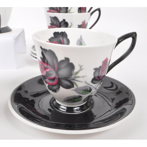 66 - Royal Albert - A 20th Century vintage bone china tea / coffee service in the black rose pattern havi... 