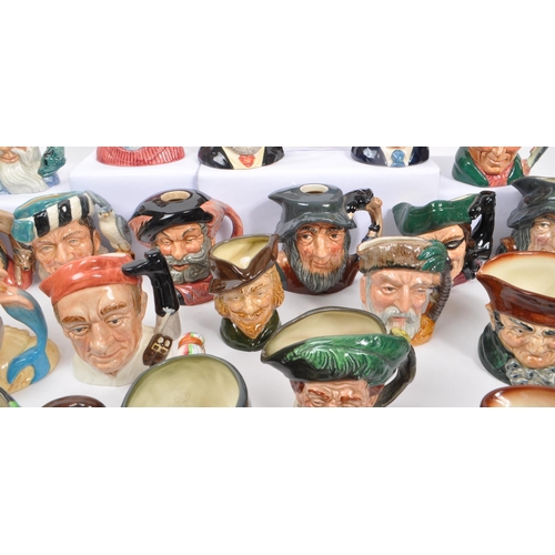 76 - Royal Doulton - A large collection of approx thirty china small toby / character jugs comprising of ... 