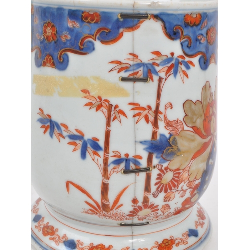 99 - A 17th century Kangxi period Chinese porcelain tankard / mug. With hand painted body in the red and ... 