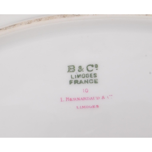 180 - L. Bernardaud & Co Limoges - A collection of five early 20th Century porcelain china graduating oval... 