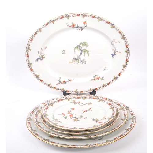 180 - L. Bernardaud & Co Limoges - A collection of five early 20th Century porcelain china graduating oval... 