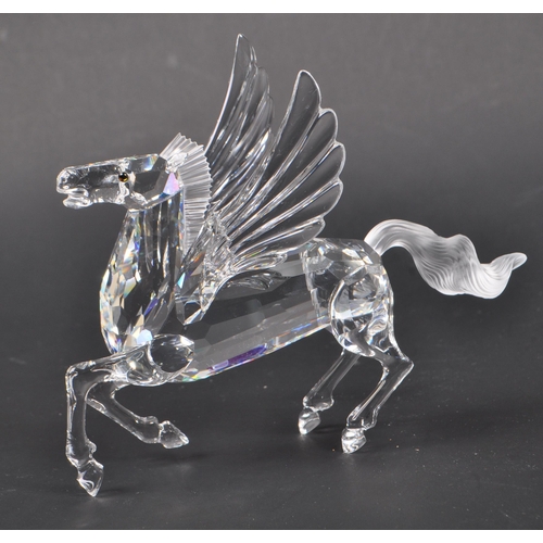 199 - Swarovski - A crystal glass Swarovski figurine / ornament in the form of a Pegasus 216327 having win... 