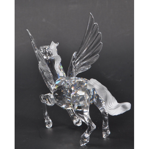 199 - Swarovski - A crystal glass Swarovski figurine / ornament in the form of a Pegasus 216327 having win... 