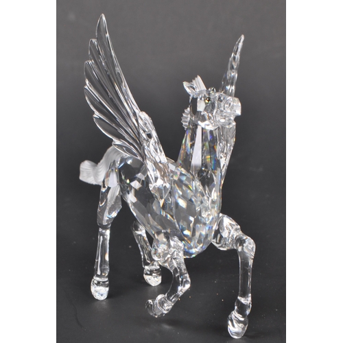 199 - Swarovski - A crystal glass Swarovski figurine / ornament in the form of a Pegasus 216327 having win... 