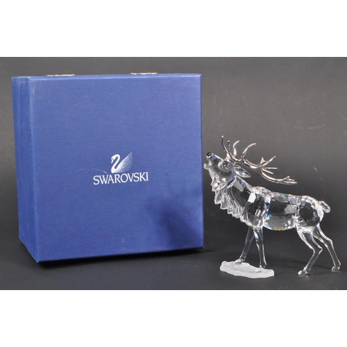 115 - Swarovski - A crystal glass Swarovski figurine / ornament in the form of a stag 291431 in standing p... 