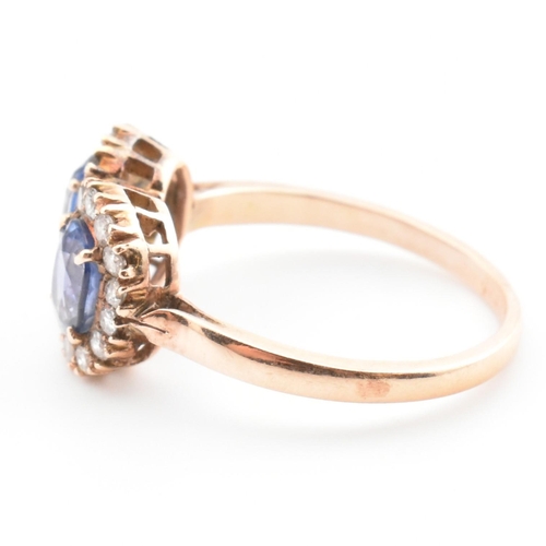 1 - A rose gold, sapphire and diamond double cluster ring. The vintage ring having two four claw set ova... 