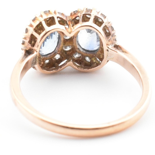 1 - A rose gold, sapphire and diamond double cluster ring. The vintage ring having two four claw set ova... 