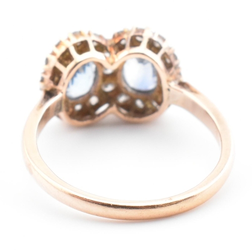 1 - A rose gold, sapphire and diamond double cluster ring. The vintage ring having two four claw set ova... 