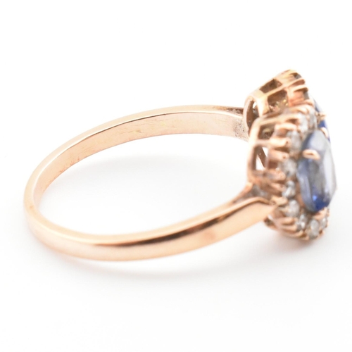 1 - A rose gold, sapphire and diamond double cluster ring. The vintage ring having two four claw set ova... 