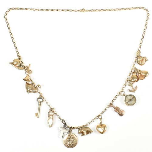 109 - A hallmarked 9ct gold charm necklace. The hallmarked 9ct gold belcher chain necklace strung with fou... 