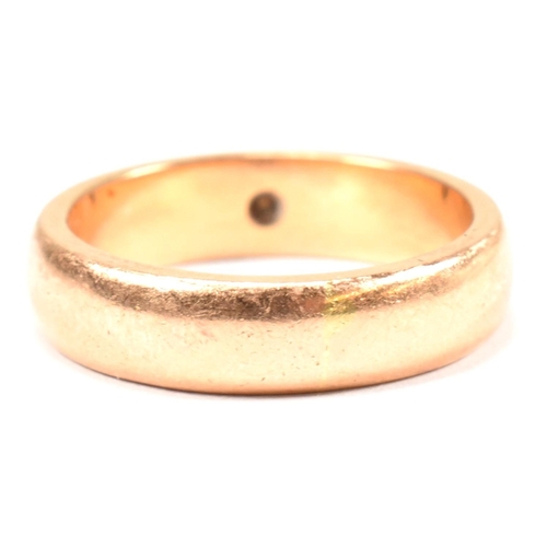 110 - A gold and paste band ring. The band ring having a star set round cut white paste stone. Unmarked ho... 