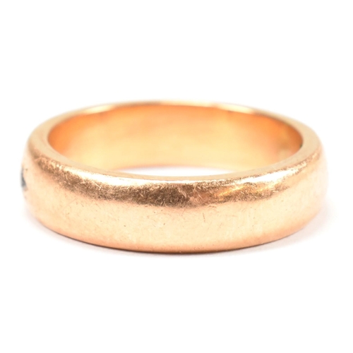 110 - A gold and paste band ring. The band ring having a star set round cut white paste stone. Unmarked ho... 