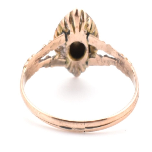 114 - An early 20th century 9ct gold and seed pearl navette ring. The Edwardian 9ct gold navette ring set ... 