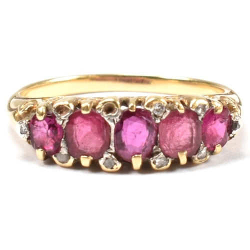 123 - A gold, red stone and diamond five stone ring. The ring having a mixture of mixed cut red stones inc... 