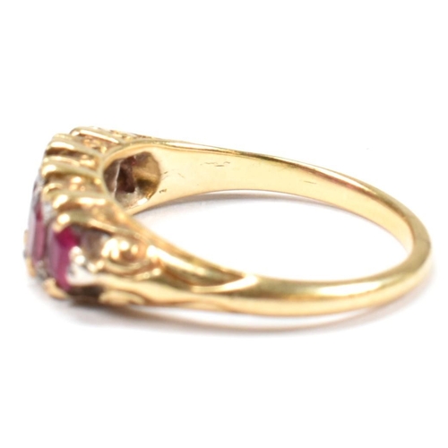 123 - A gold, red stone and diamond five stone ring. The ring having a mixture of mixed cut red stones inc... 