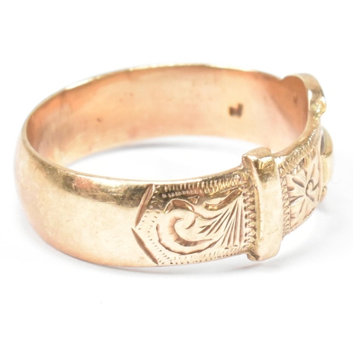 125 - A hallmarked 9ct gold buckle ring. The buckle ring having scrolling bright cut engraved decoration t... 