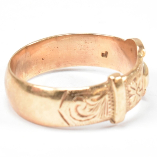 125 - A hallmarked 9ct gold buckle ring. The buckle ring having scrolling bright cut engraved decoration t... 