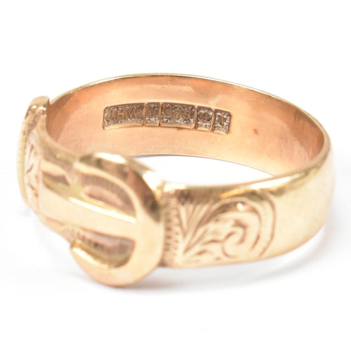 125 - A hallmarked 9ct gold buckle ring. The buckle ring having scrolling bright cut engraved decoration t... 