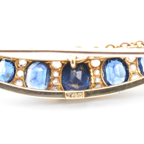 13 - An early 20th century gold, diamond and sapphire crescent brooch pin. The crescent brooch pin set wi... 