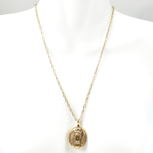 131 - An 19th century gold and seed pearl buckle locket pendant necklace. The 9ct yellow gold cable chain ... 