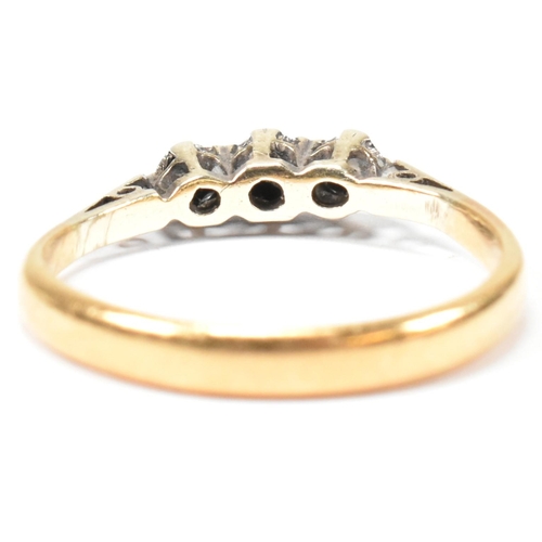 136 - An 18ct gold and diamond trilogy ring. The ring having three star set round cut diamonds to tapered ... 