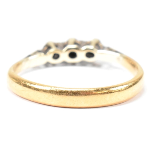 136 - An 18ct gold and diamond trilogy ring. The ring having three star set round cut diamonds to tapered ... 