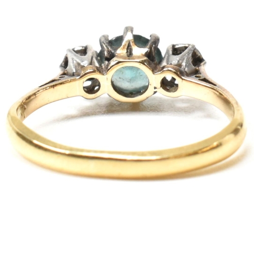 142 - An 18ct gold, zircon and diamond three stone ring. The ring having a central six claw set round cut ... 