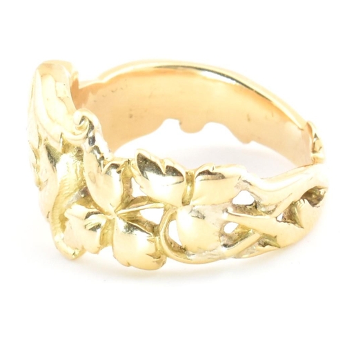 15 - An 18ct gold and diamond Art Nouveau dragon ring. The gold ring having a carved Chinese Qilin design... 