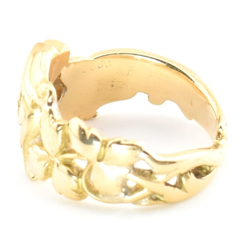 15 - An 18ct gold and diamond Art Nouveau dragon ring. The gold ring having a carved Chinese Qilin design... 