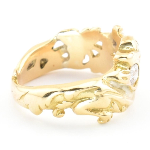 15 - An 18ct gold and diamond Art Nouveau dragon ring. The gold ring having a carved Chinese Qilin design... 