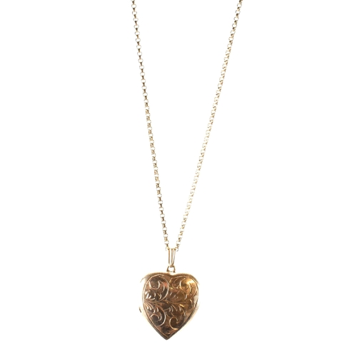 166 - A hallmarked 9ct gold heart locket pendant necklace. The 9ct yellow gold belcher chain necklace stru... 