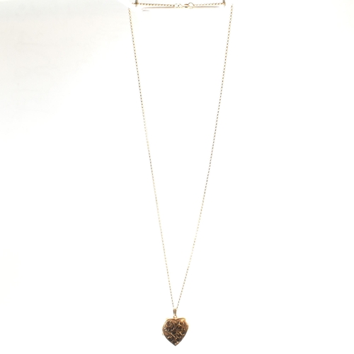 166 - A hallmarked 9ct gold heart locket pendant necklace. The 9ct yellow gold belcher chain necklace stru... 