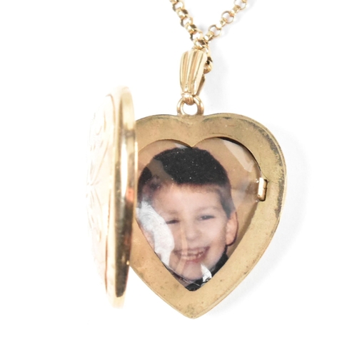 166 - A hallmarked 9ct gold heart locket pendant necklace. The 9ct yellow gold belcher chain necklace stru... 