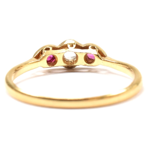 190 - An 18ct gold and platinum synthetic ruby and spinel ring. The ring having a central illusion set rou... 