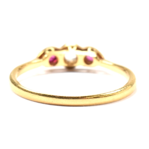 190 - An 18ct gold and platinum synthetic ruby and spinel ring. The ring having a central illusion set rou... 