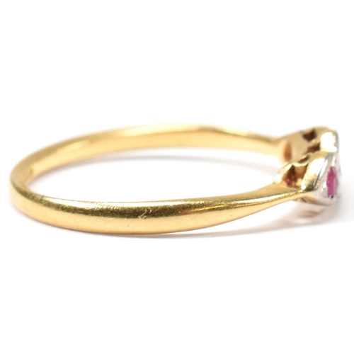 190 - An 18ct gold and platinum synthetic ruby and spinel ring. The ring having a central illusion set rou... 