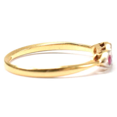 190 - An 18ct gold and platinum synthetic ruby and spinel ring. The ring having a central illusion set rou... 