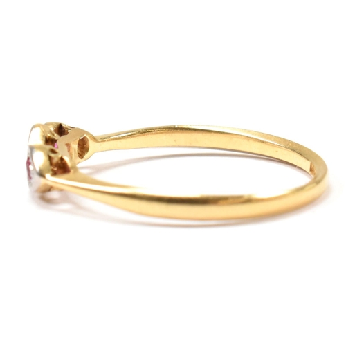 190 - An 18ct gold and platinum synthetic ruby and spinel ring. The ring having a central illusion set rou... 