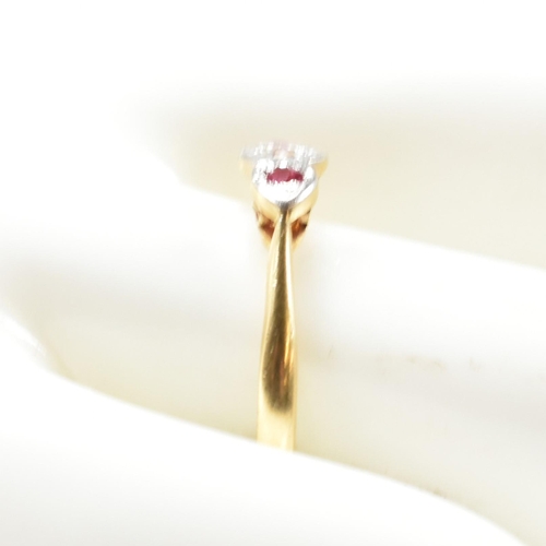 190 - An 18ct gold and platinum synthetic ruby and spinel ring. The ring having a central illusion set rou... 