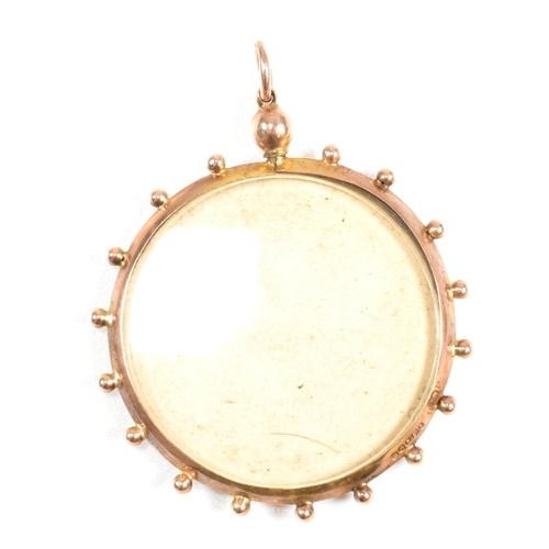 197 - A hallmarked 9ct gold photo window locket pendant. The hallmarked 9ct gold locket having two windows... 