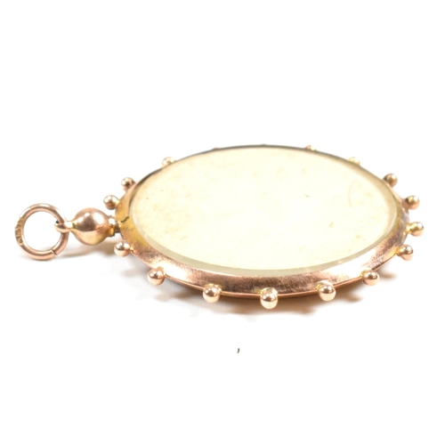 197 - A hallmarked 9ct gold photo window locket pendant. The hallmarked 9ct gold locket having two windows... 