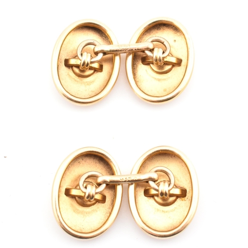 2 - A pair of 14ct gold and diamond cufflinks. The 14ct gold bar link cufflinks having polished oval hea... 