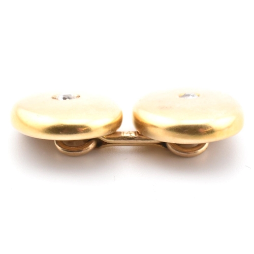 2 - A pair of 14ct gold and diamond cufflinks. The 14ct gold bar link cufflinks having polished oval hea... 