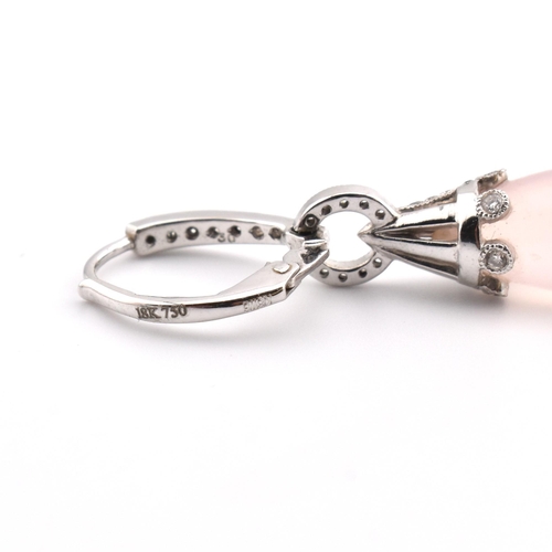 22 - A pair of 18ct white gold, rose quartz and diamond pendant earrings. The pendant earrings having a s... 