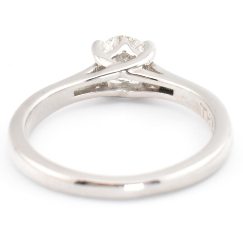 25 - A Leo Diamond 950 platinum and diamond solitaire ring. The Leo Diamond ring set with a single four c... 