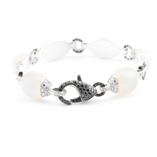 30 - An 18ct white gold, chalcedony and diamond panel bracelet. The 18ct white gold bracelet having point... 