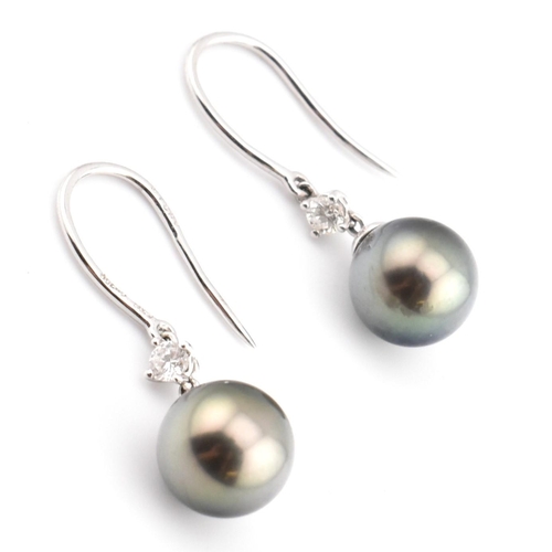 34 - A pair of 18ct white gold cultured pearl and diamond drop earrings. The pendant earrings having a ro... 