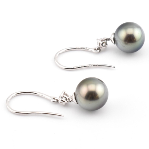 34 - A pair of 18ct white gold cultured pearl and diamond drop earrings. The pendant earrings having a ro... 