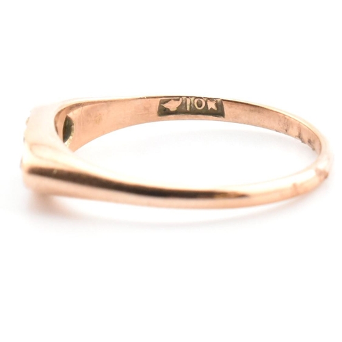 354 - A 10ct gold, sapphire and diamond boat ring. The 10ct rose gold ring having a central four claw roun... 