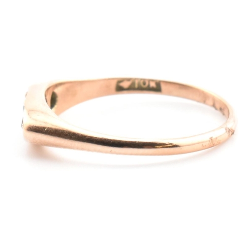 354 - A 10ct gold, sapphire and diamond boat ring. The 10ct rose gold ring having a central four claw roun... 